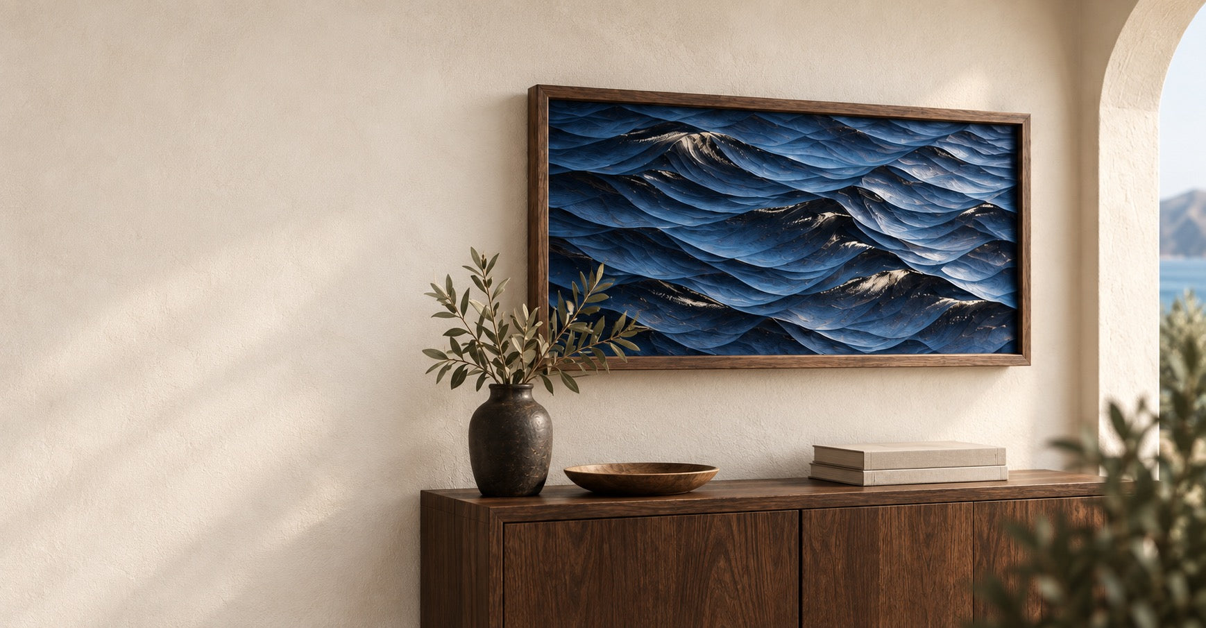 Concept interior featuring framed blue ocean relief art